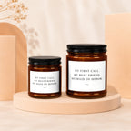 Two amber glass candles with black lids display "My First Call. My Best Friend. My Maid of Honor." text.
