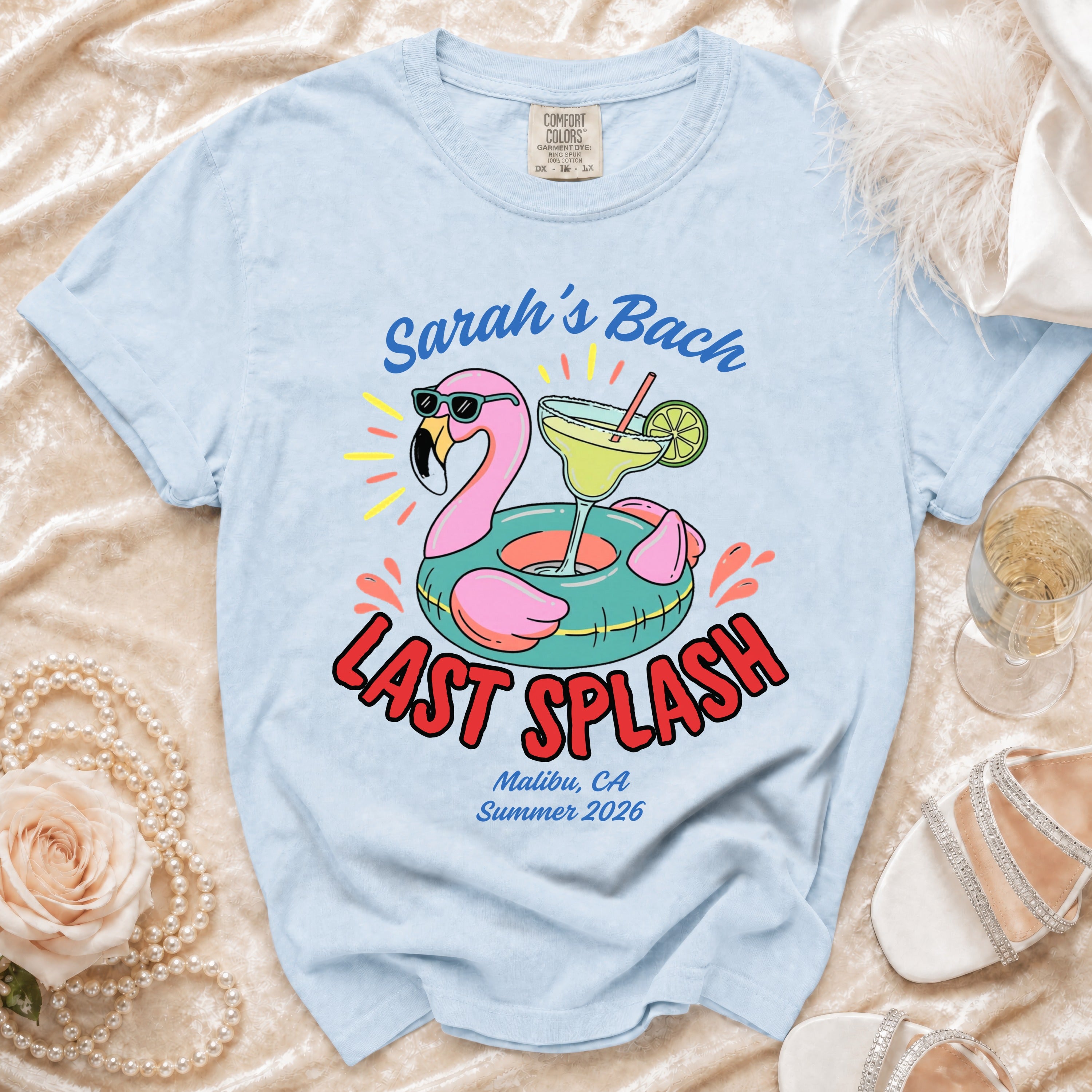 Light blue t-shirt with "Sarah's Bach LAST SPLASH" and flamingo graphic.