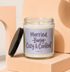 Candle with text "Married, Cozy & Content" and "VOWED" on label