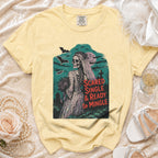 Yellow t-shirt with a skeleton bride graphic and text "Scared Single & Ready to Mingle".