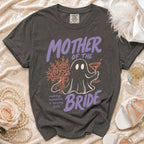 Grey t-shirt with "Mother of the Bride" ghost graphic and floral accents.