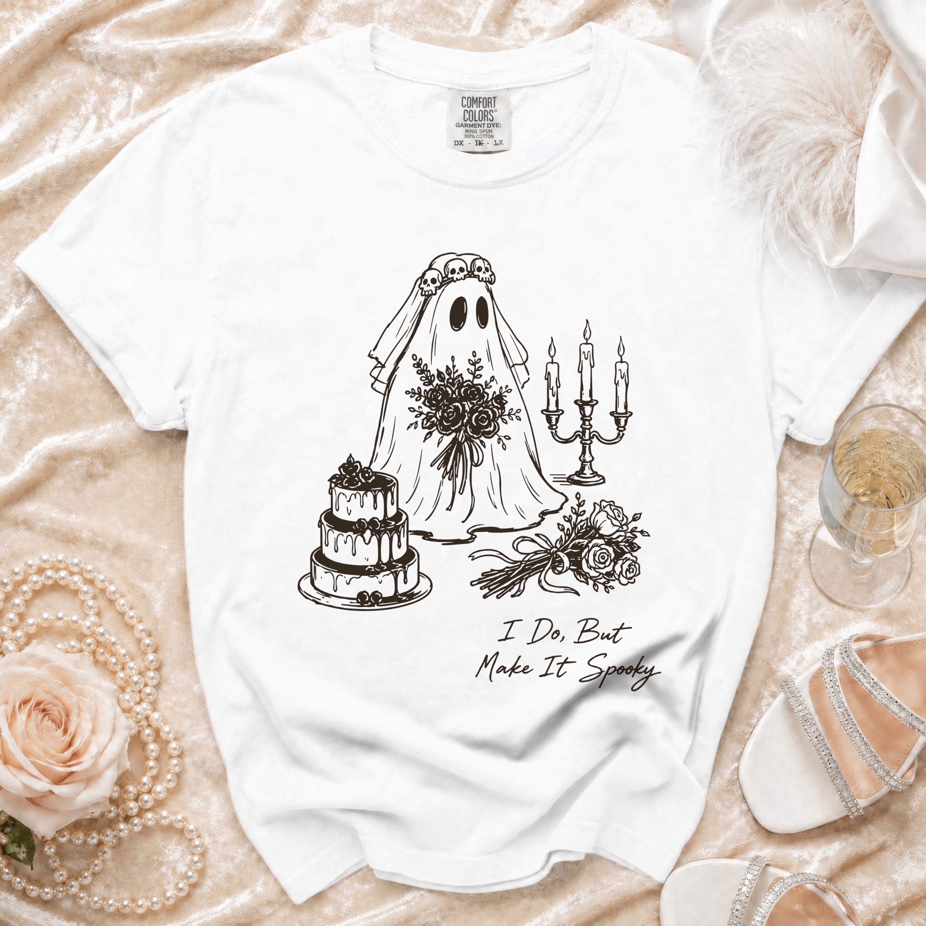 White t-shirt with a ghost bride design, wedding cake, and text "I Do, But Make It Spooky."