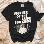 Black Comfort Colors t-shirt with "Mother of the Bride Boo Crew" graphic.