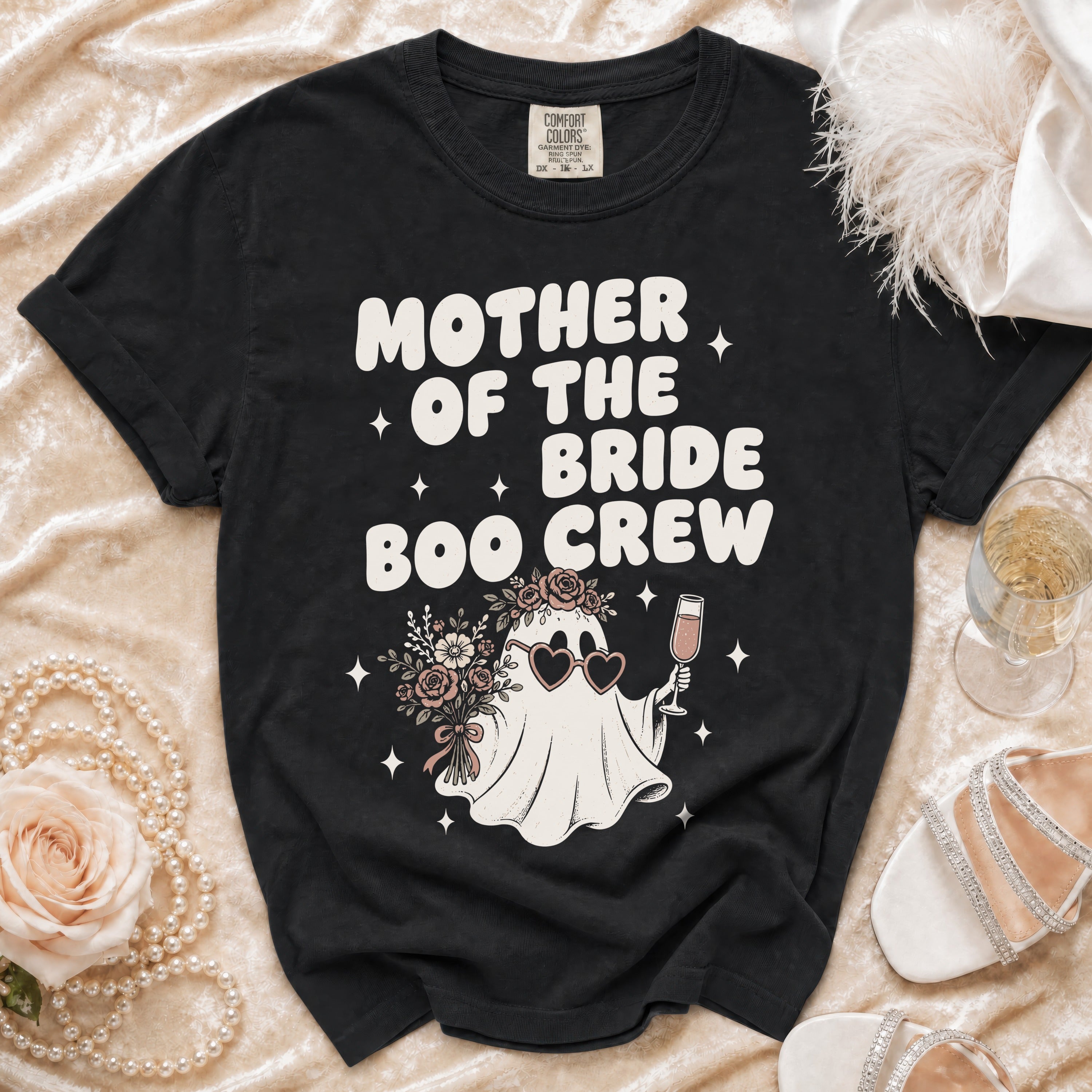 Black Comfort Colors t-shirt with "Mother of the Bride Boo Crew" graphic.