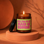 Amber jar candle with a lit wick and a label asking "Will you be my Maid of Honor?".