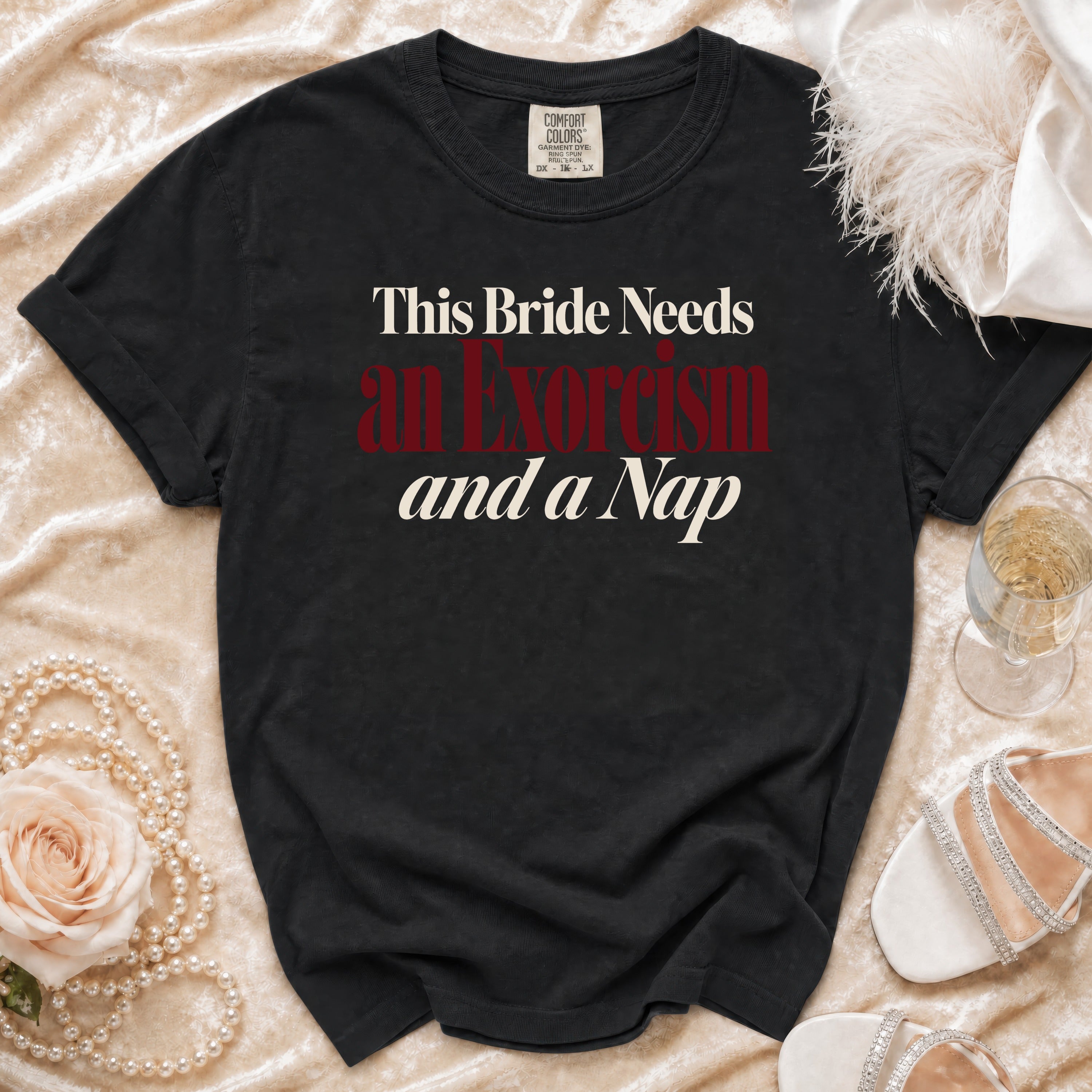 Black Comfort Colors t-shirt with "This Bride Needs an Exorcism and a Nap" text.