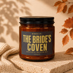 Amber candle with black lid, label reads "The Bride's Coven"