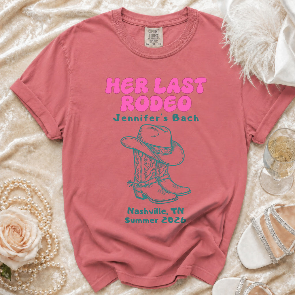 Pink t-shirt with "Her Last Rodeo" text, cowboy boots, and Nashville, TN Summer 2026.