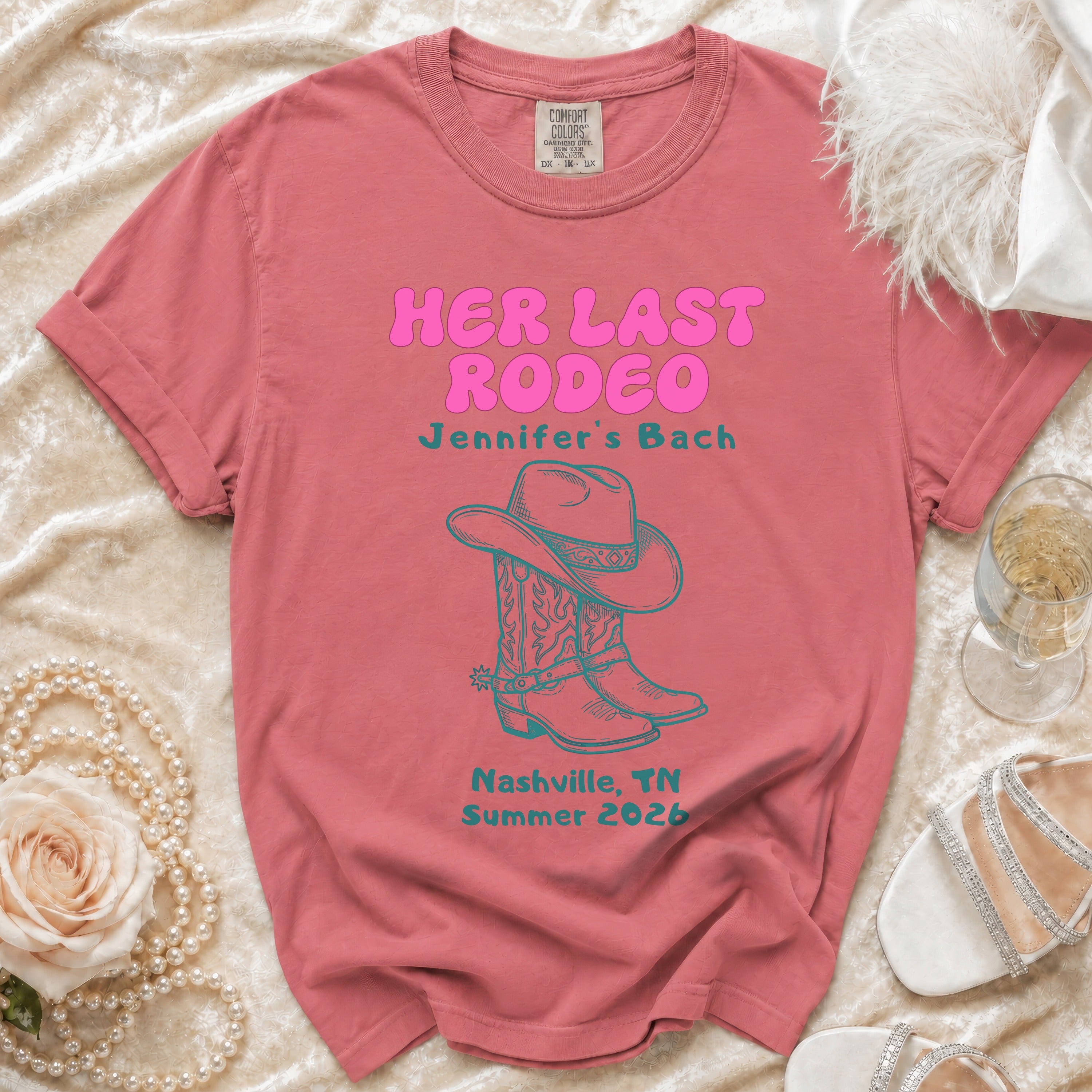 Pink t-shirt with "Her Last Rodeo" text, cowboy boots, and Nashville, TN Summer 2026.