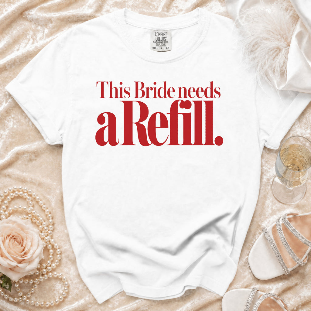 White t-shirt with red text: "This Bride needs a Refill."