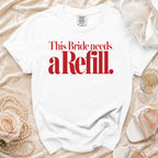 White t-shirt with red text: "This Bride needs a Refill."
