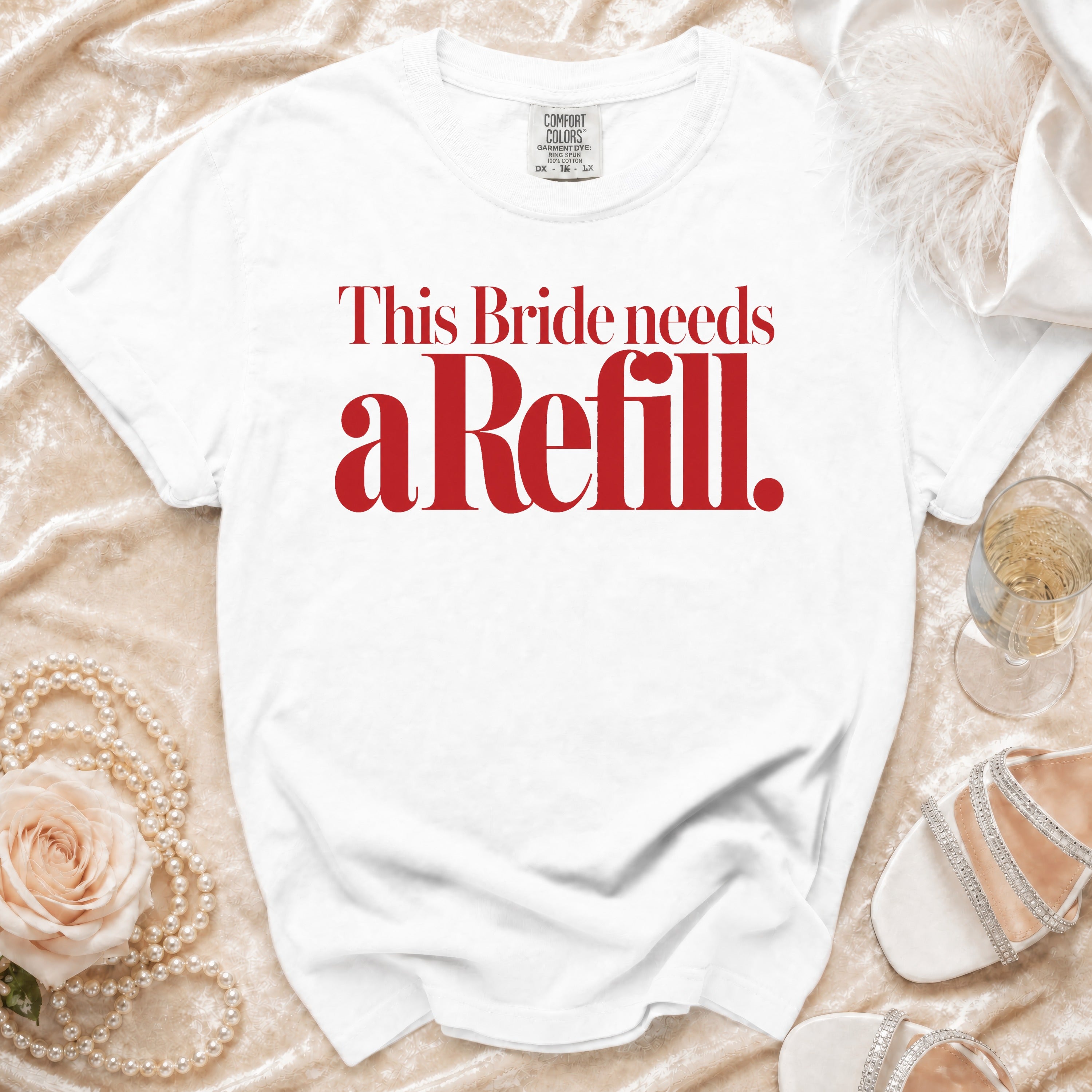 White t-shirt with red text: "This Bride needs a Refill."