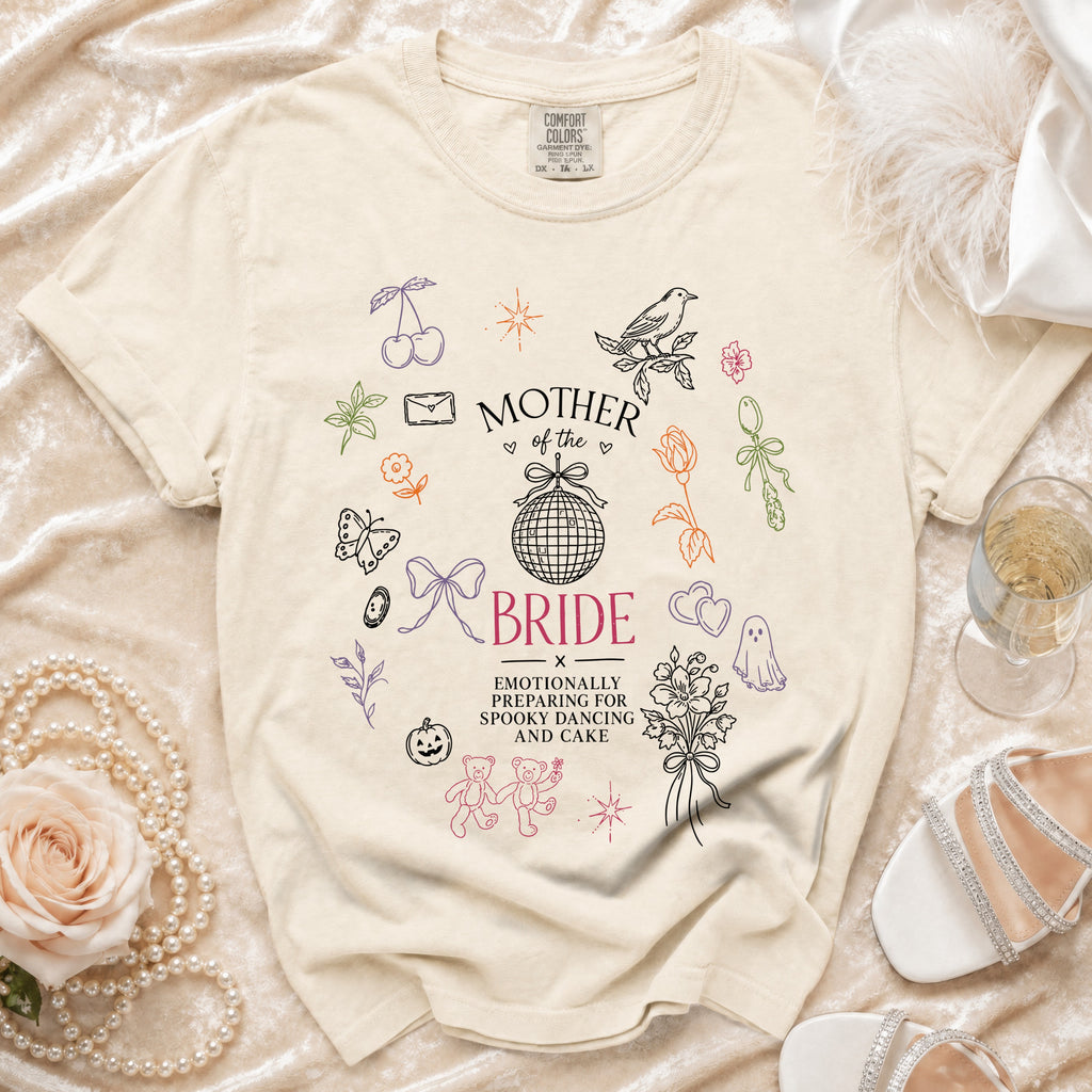 Cream t-shirt with "Mother of the Bride" and "Emotionally Preparing for Spooky Dancing and Cake" text.