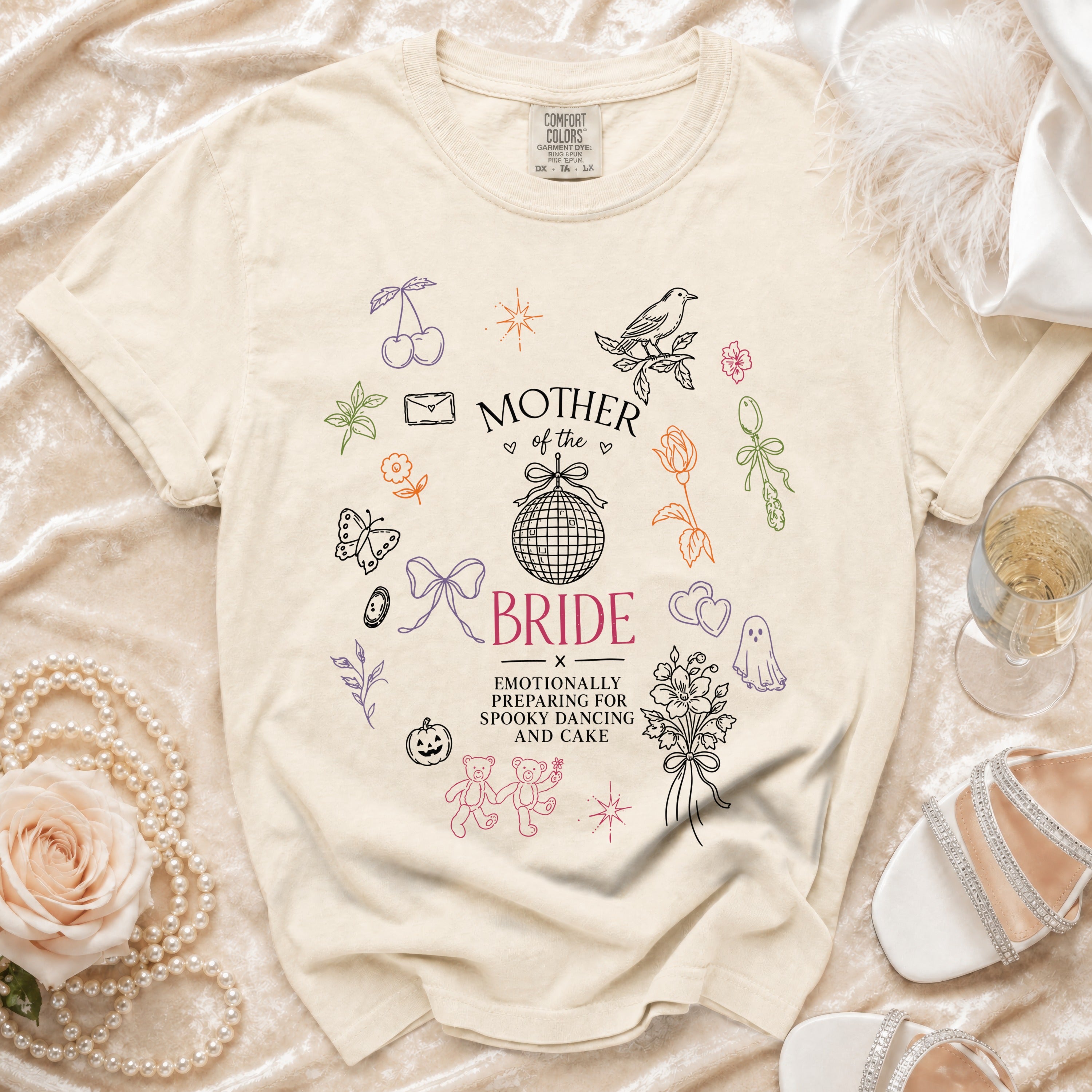 Cream t-shirt with "Mother of the Bride" and "Emotionally Preparing for Spooky Dancing and Cake" text.