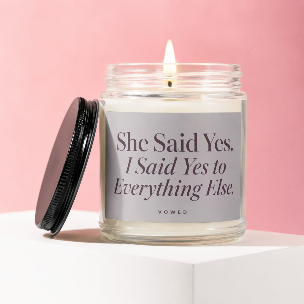 Candle with text "She Said Yes. I Said Yes to Everything Else."
