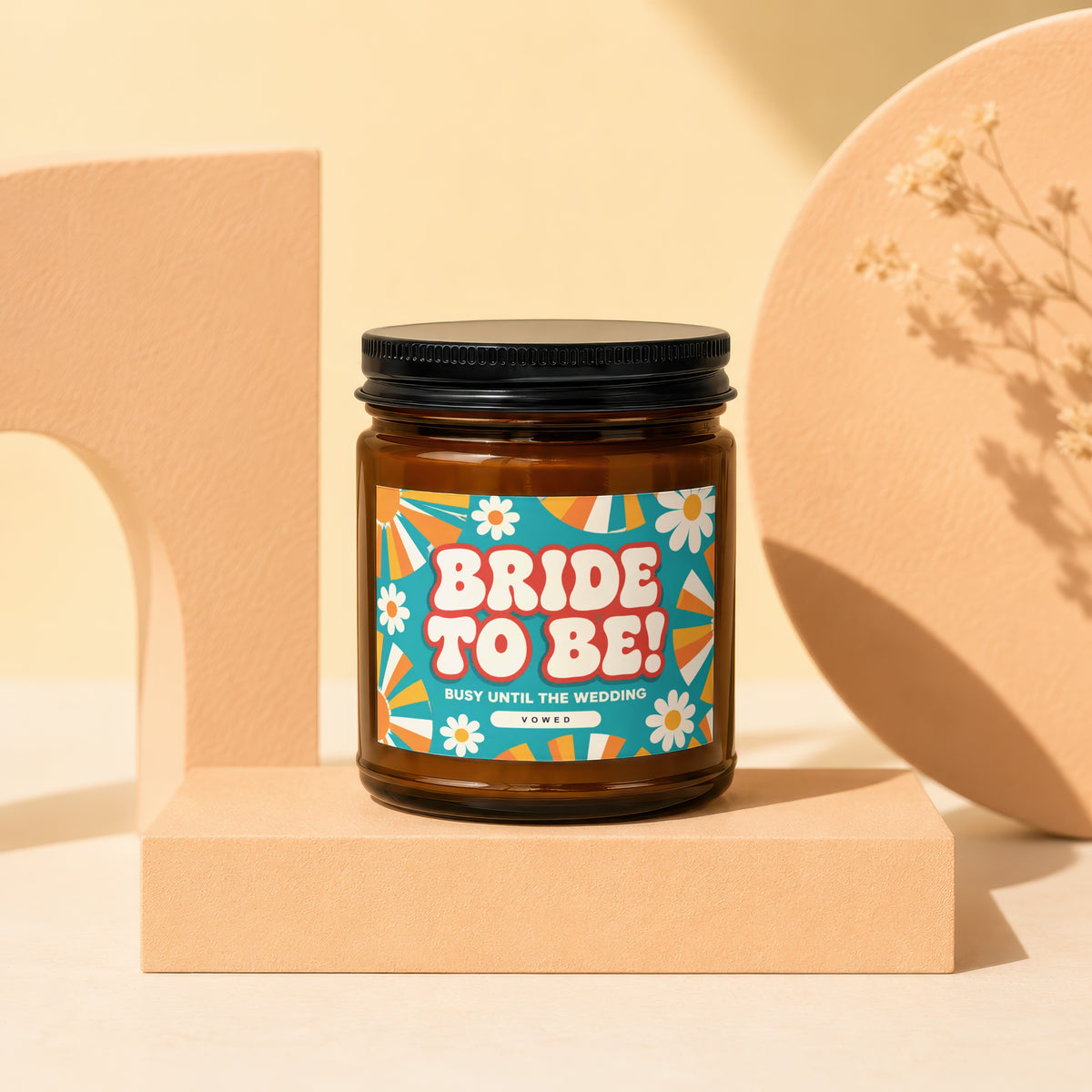 Amber jar candle with "BRIDE TO BE! BUSY UNTIL THE WEDDING VOWED" text and retro design.
