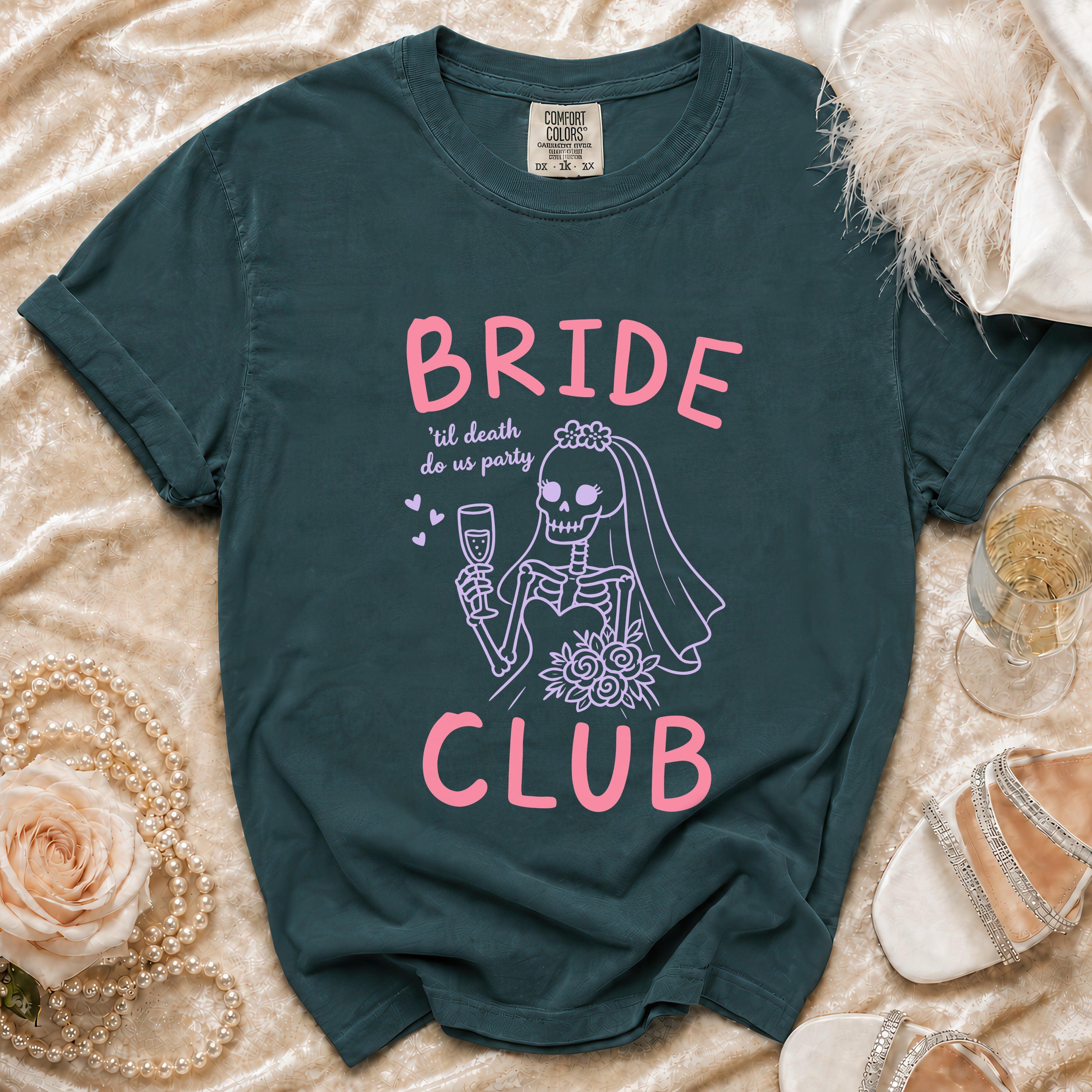 Teal t-shirt with "BRIDE 'til death do us party CLUB" text and skeleton bride graphic.