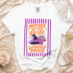 White t-shirt with "Mother of the Bride Wickedly Proud" text and witch hat graphic.