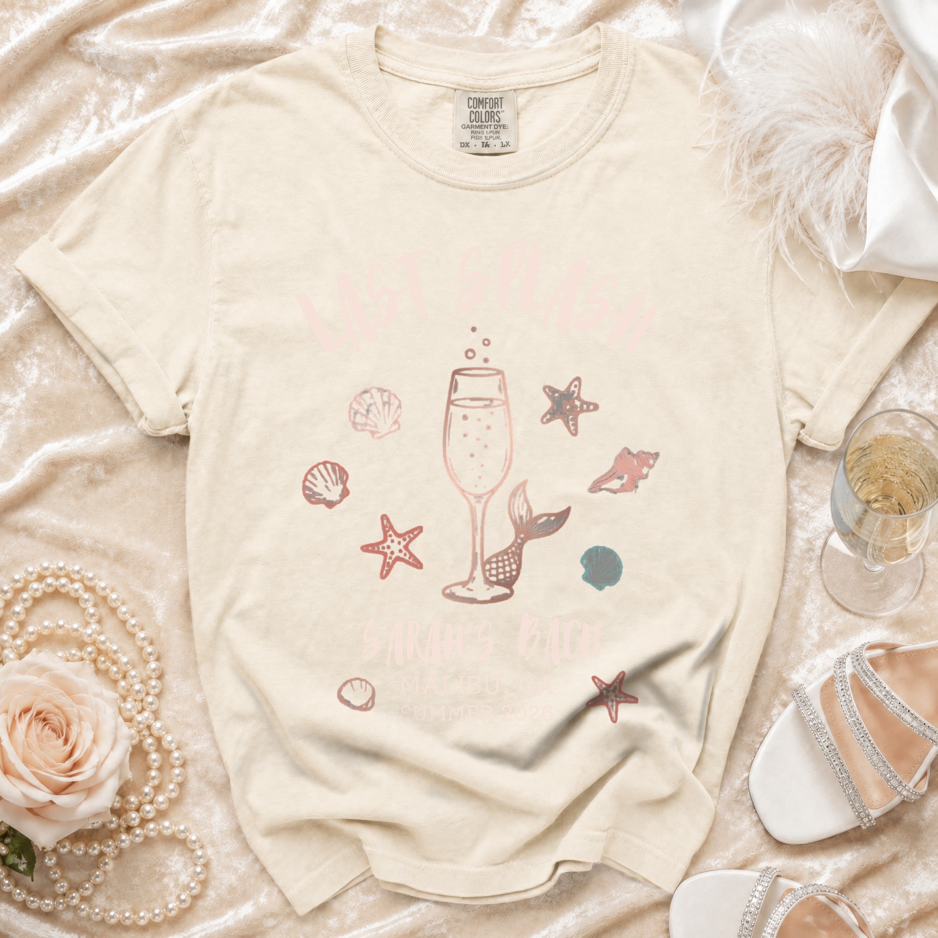 "Let's Sail" graphic tee with champagne, mermaid tail, starfish, and seashells.