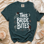 Teal t-shirt with "This Bride Bites" text and gothic wedding graphics.