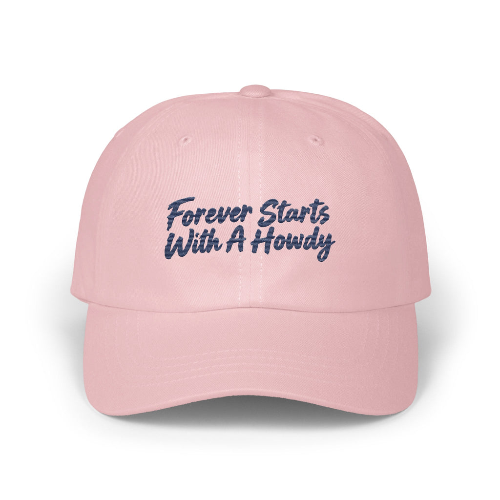 Light pink baseball cap embroidered with dark blue text reading Forever Starts With A Howdy.