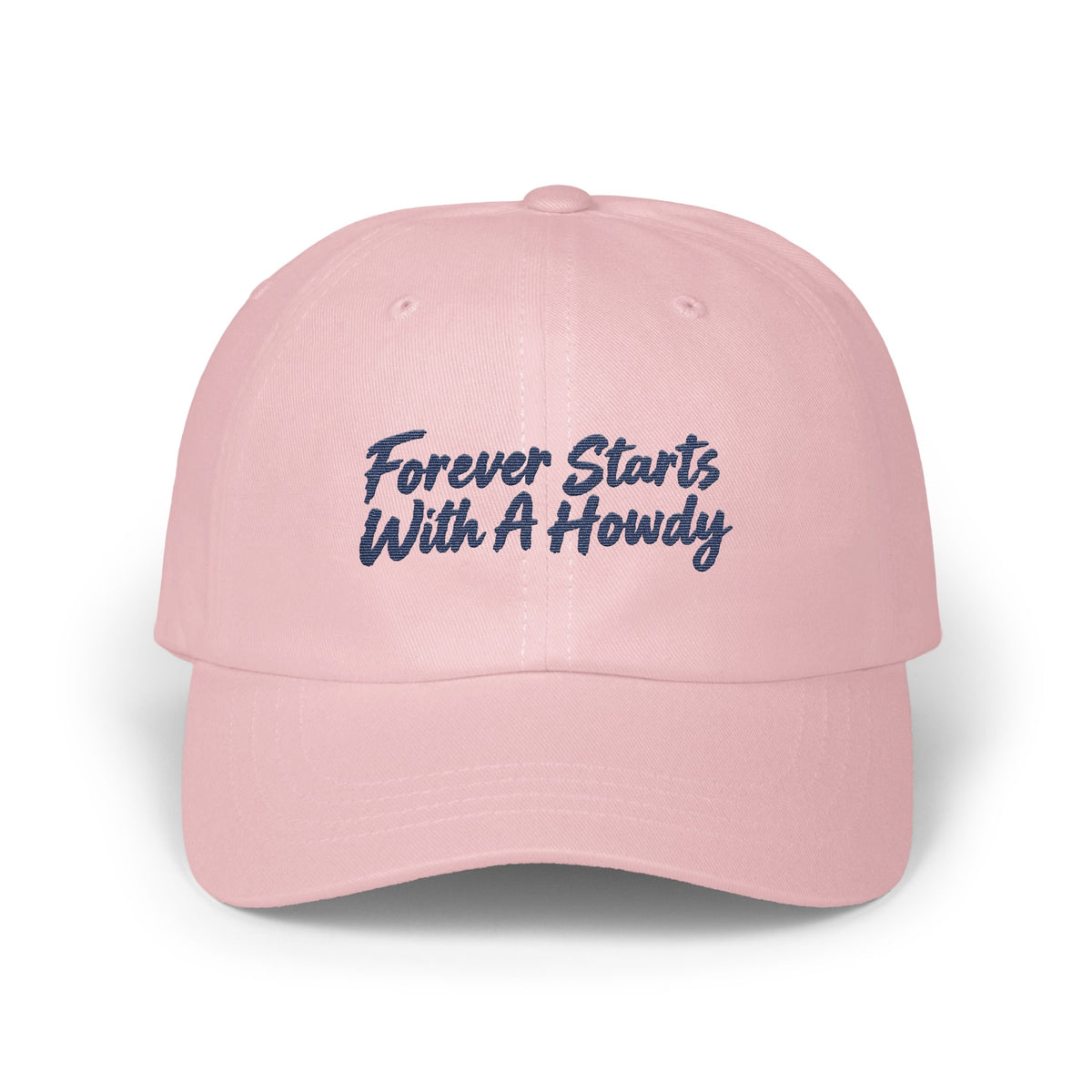 Light pink baseball cap embroidered with dark blue text reading Forever Starts With A Howdy.