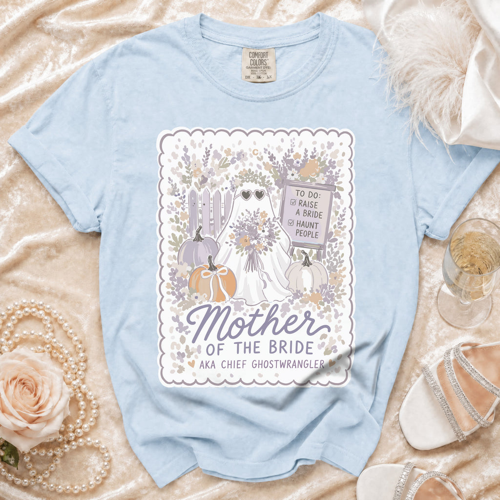Light blue t-shirt with a "Mother of the Bride AKA Chief Ghostwrangler" graphic.