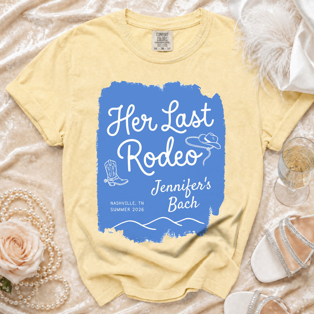 Yellow t-shirt with "Her Last Rodeo" text and cowboy boot and hat graphics.