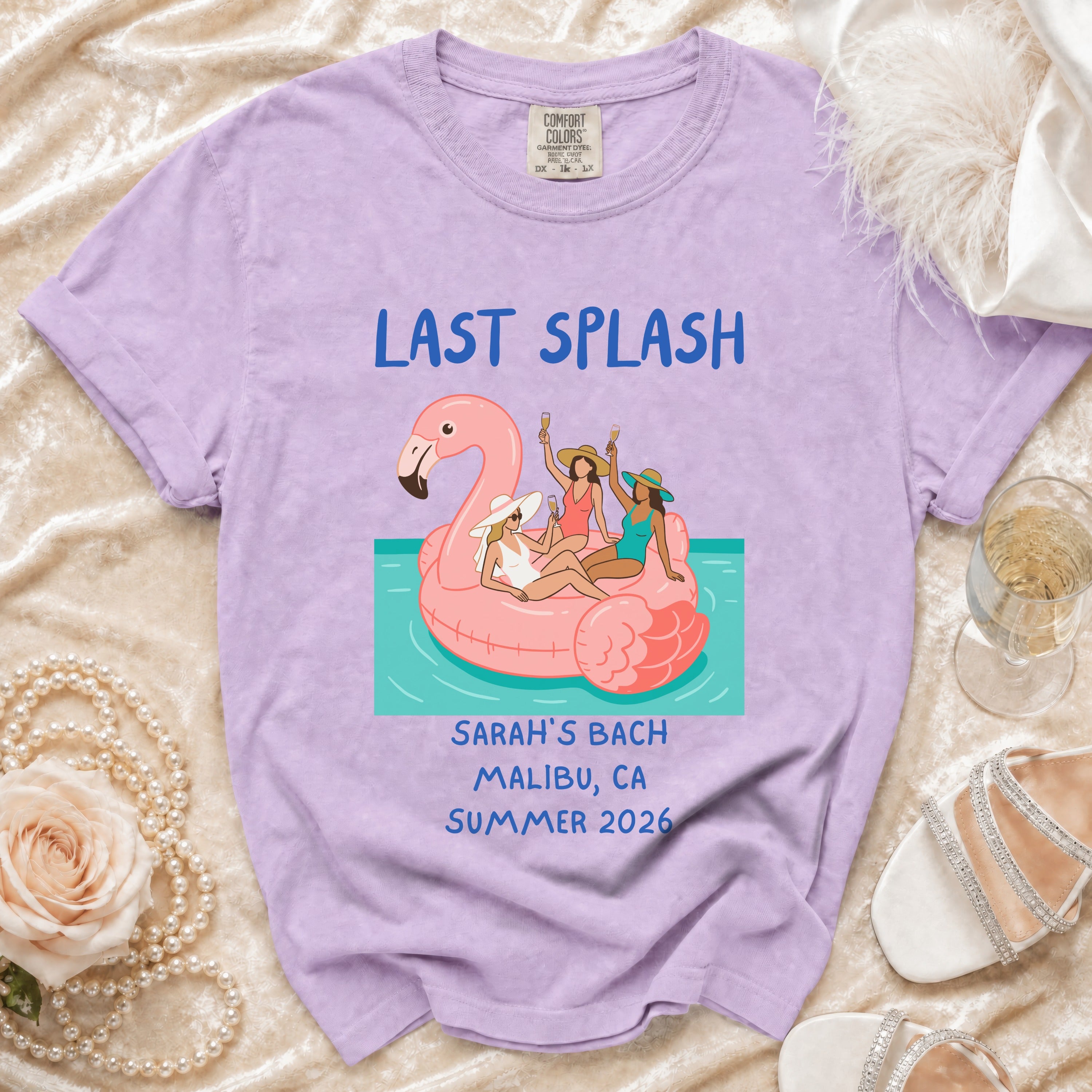 Purple t-shirt with "Last Splash Sarah's Bach Malibu CA Summer 2026" and flamingo graphic.