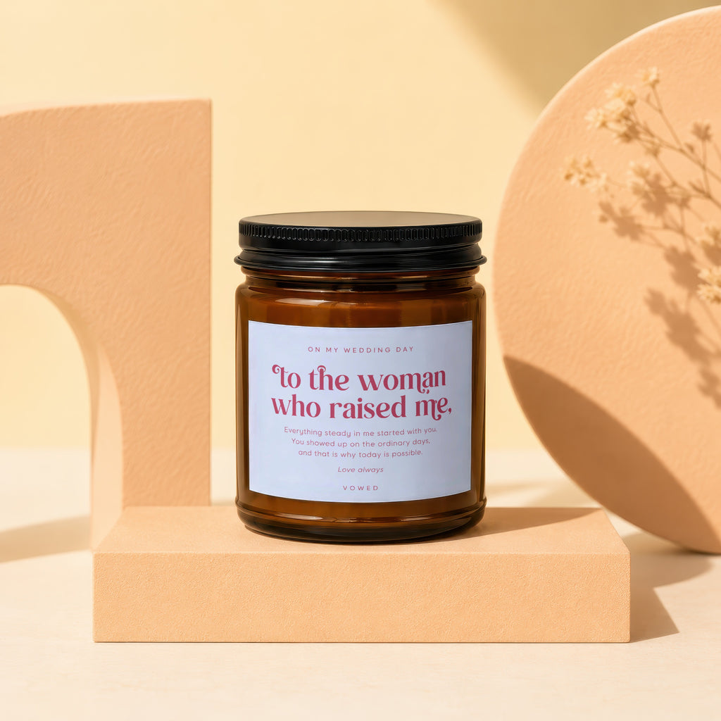 Amber candle with black lid labeled "To the woman who raised me" for wedding day.