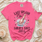 "Last Splash Che!" text on pink t-shirt with champagne bottle, flamingo, and glasses.