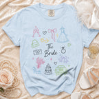 Light blue t-shirt with wedding themed line art and the text "The Bride".