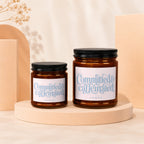 Amber glass candles with "Committed & Caffeinated" text on labels.