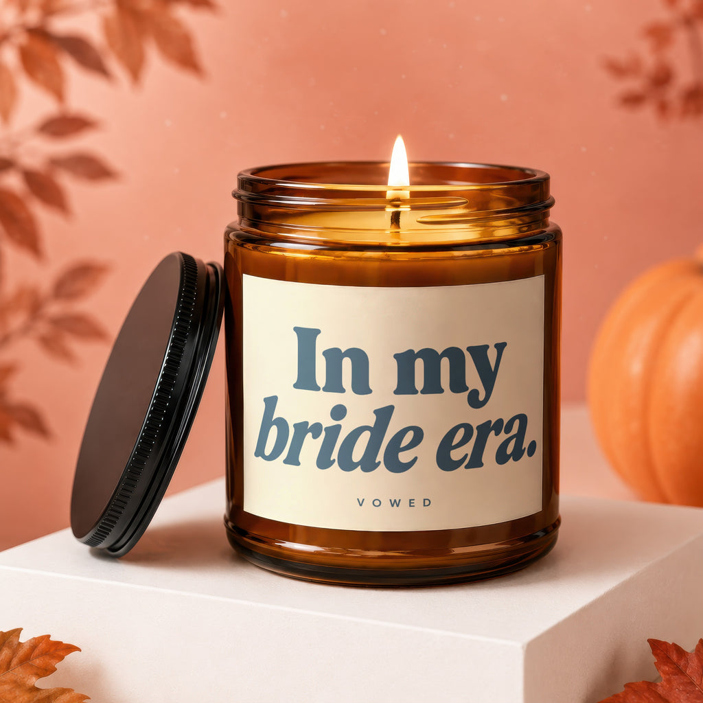 Amber candle with "In my bride era." text and "vowed" below.