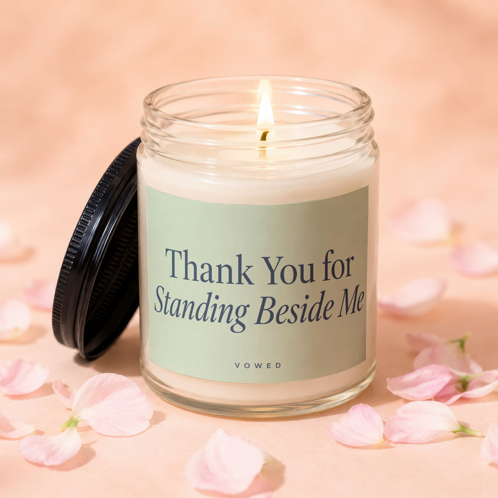 Candle with lid off, lit wick, and "Thank You for Standing Beside Me" text.