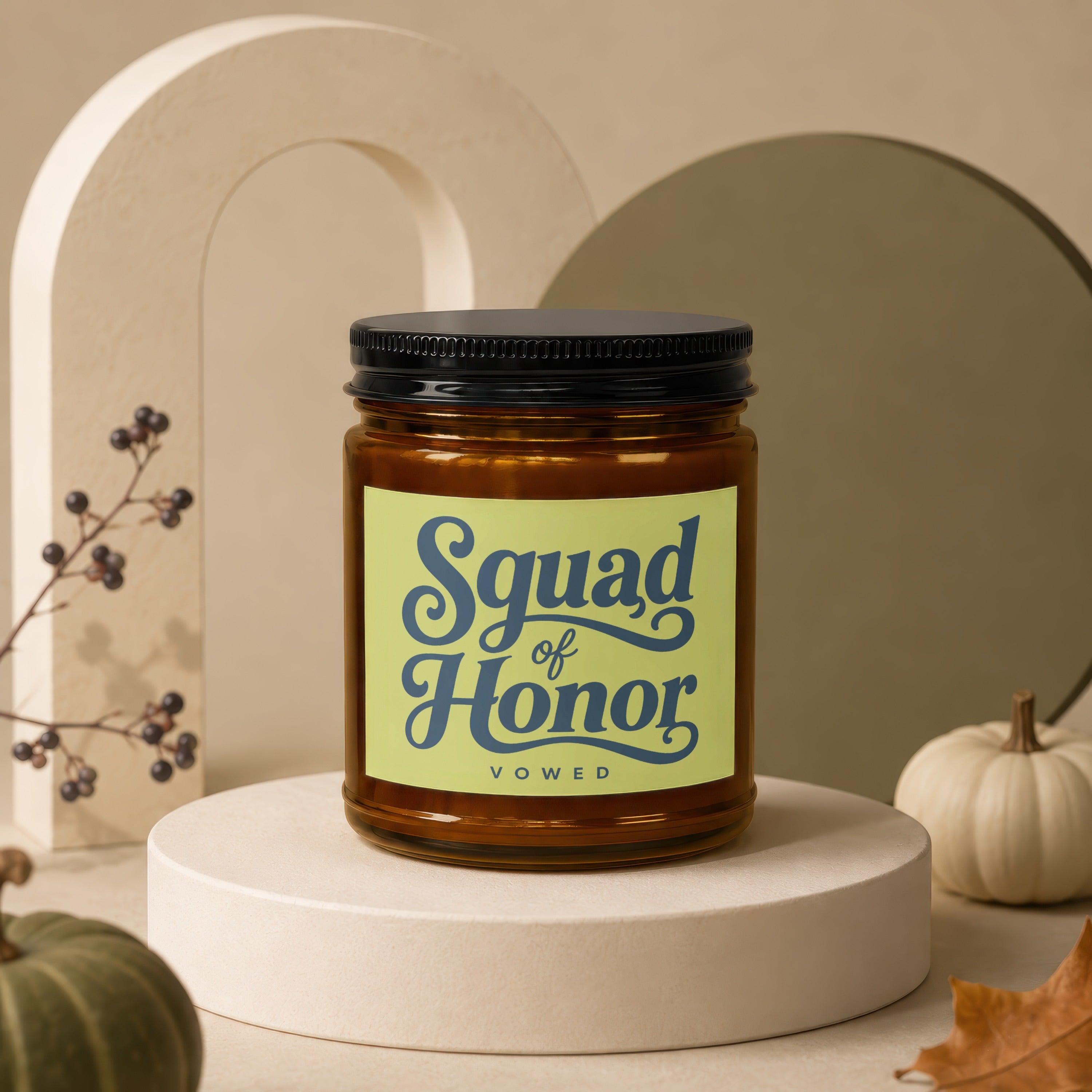 Amber jar candle with a light green label reading "Squad of Honor VOWED."