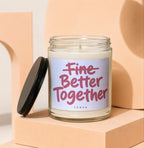 Glass candle with black lid and label text "Fine Better Together".