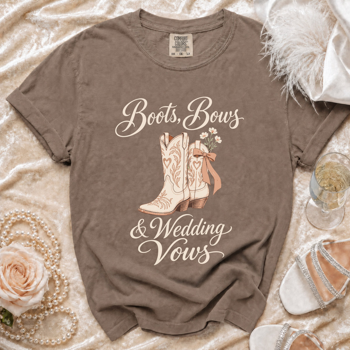 Brown Comfort Colors t-shirt with "Boots, Bows & Wedding Vows" graphic.