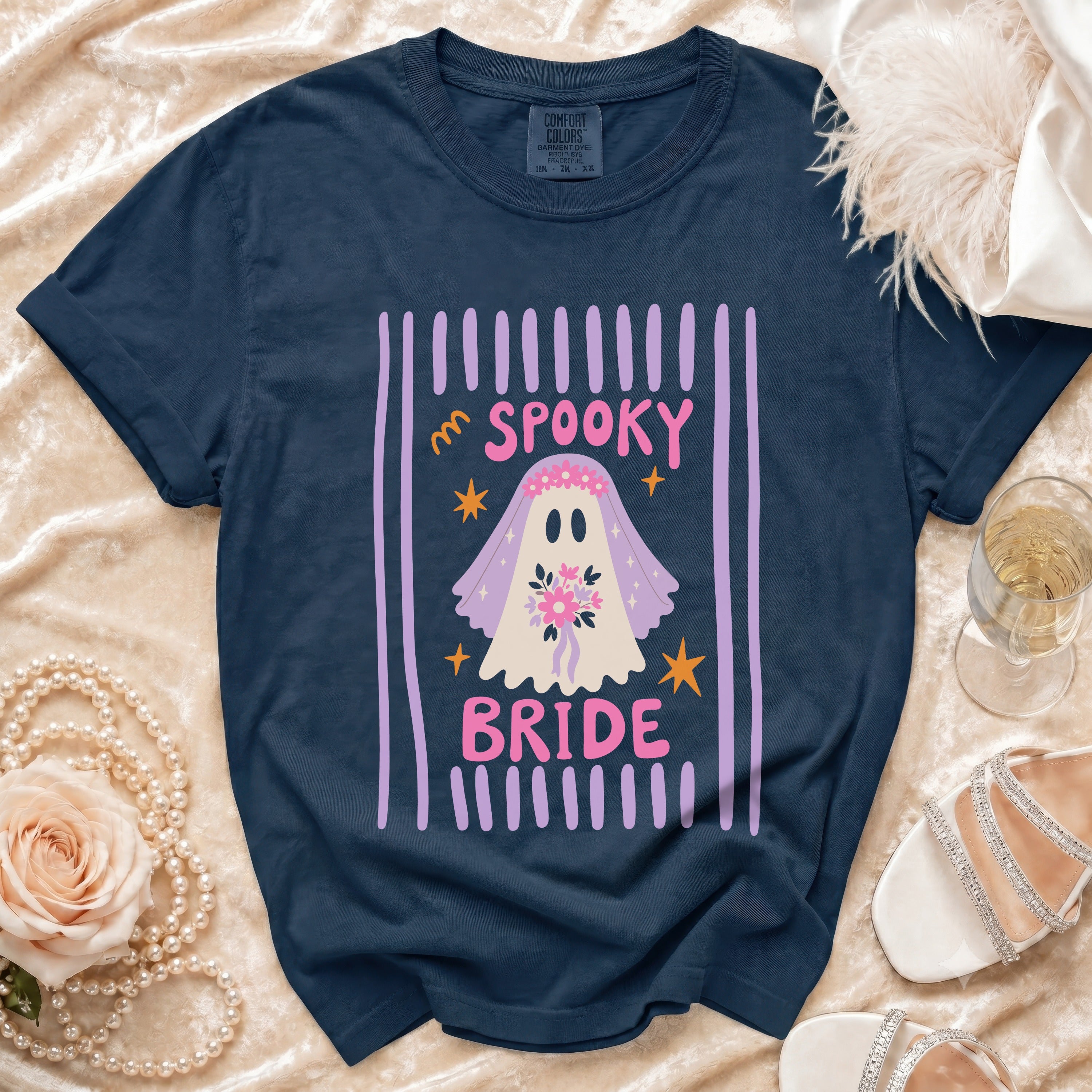 Navy t-shirt with a spooky bride ghost graphic and pink text.