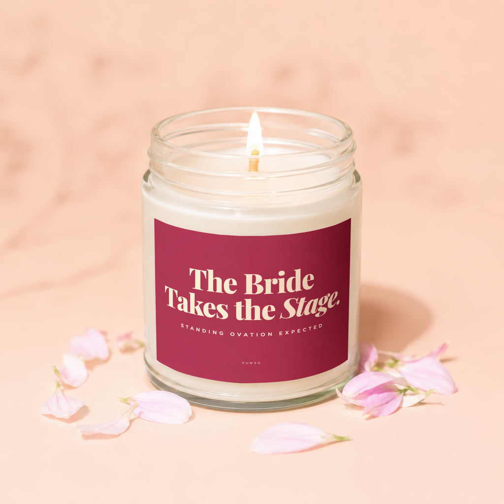 Candle with text "The Bride Takes the Stage. Standing Ovation Expected."
