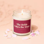 Candle with text "The Bride Takes the Stage. Standing Ovation Expected."