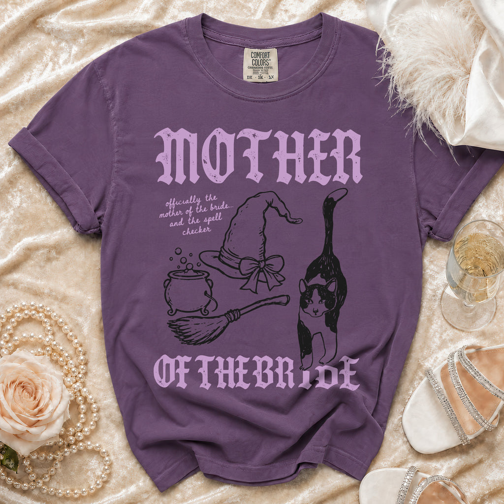 Purple t-shirt with "MOTHER OF THE BRIDE" and witchy graphics.