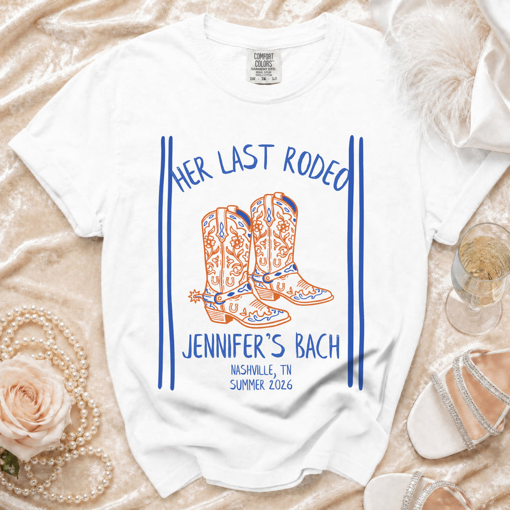 White t-shirt with "Her Last Rodeo" and cowboy boots graphic.