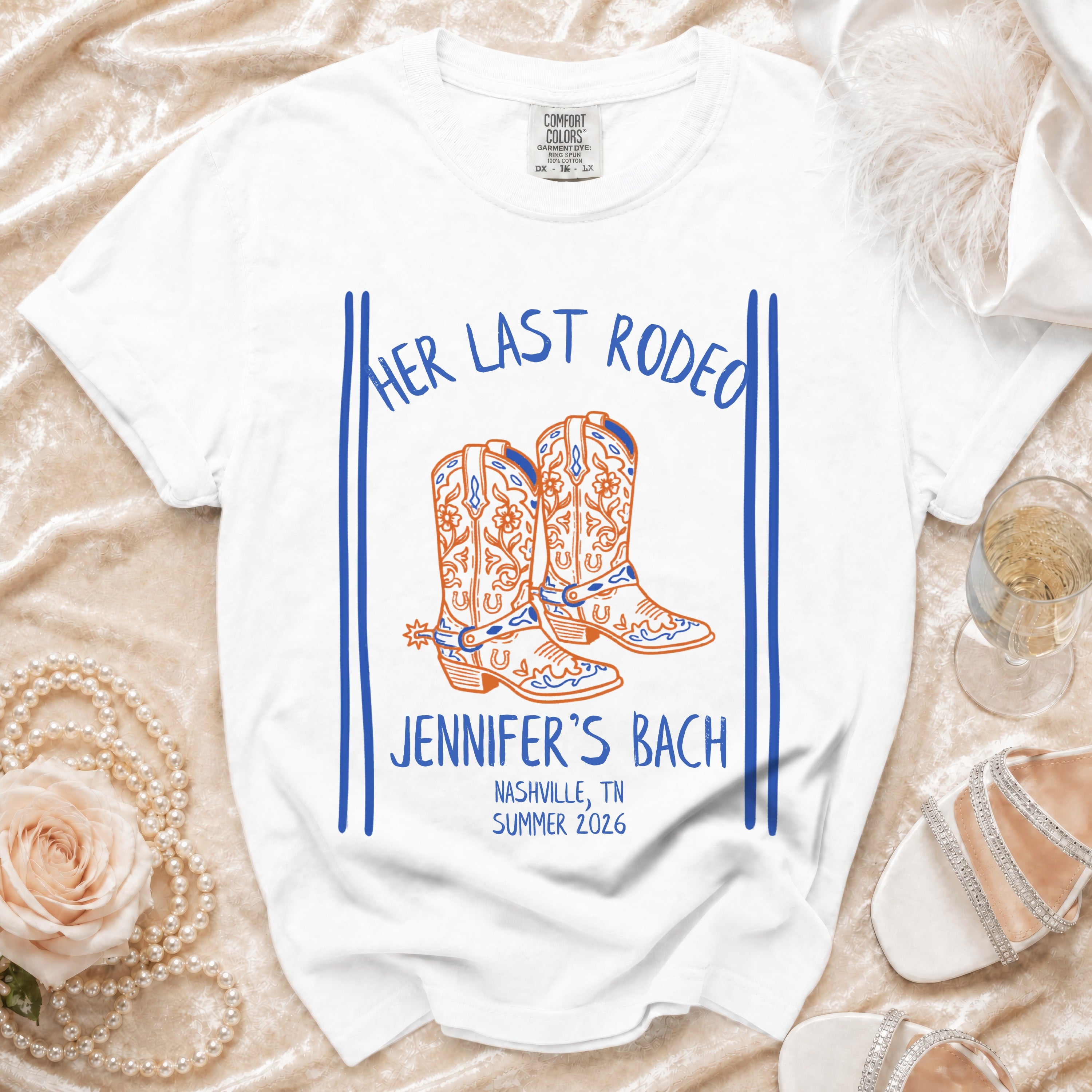White t-shirt with "Her Last Rodeo" and cowboy boots graphic.