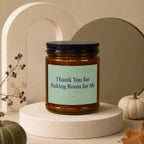 Amber jar candle with "Thank You for Making Room for Me." text.