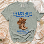 "Her Last Rodeo" text and cowboy boots graphic on a t-shirt.