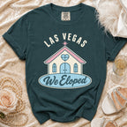 Teal t-shirt with "Las Vegas We Eloped" text and wedding chapel graphic.