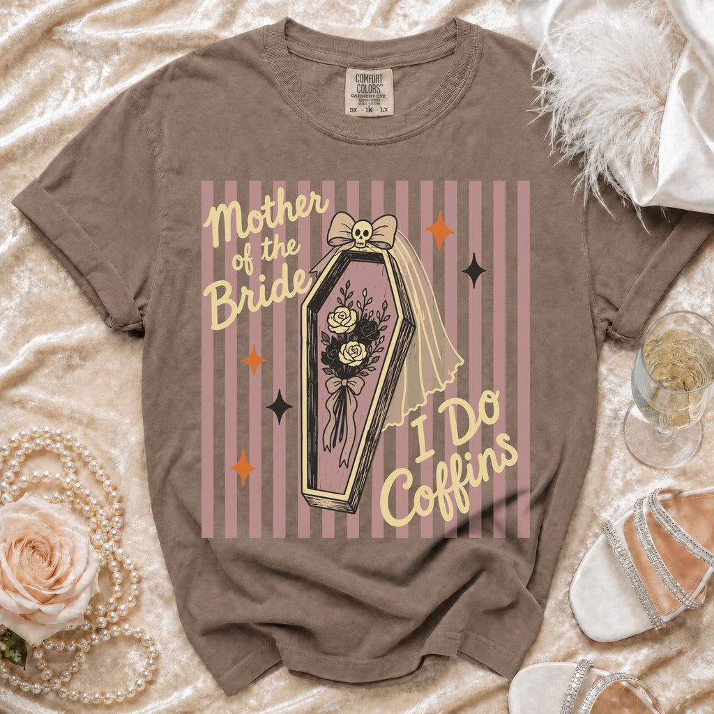 T-shirt with "Mother of the Bride I Do Coffins" graphic on striped background.
