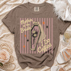 T-shirt with "Mother of the Bride I Do Coffins" graphic on striped background.