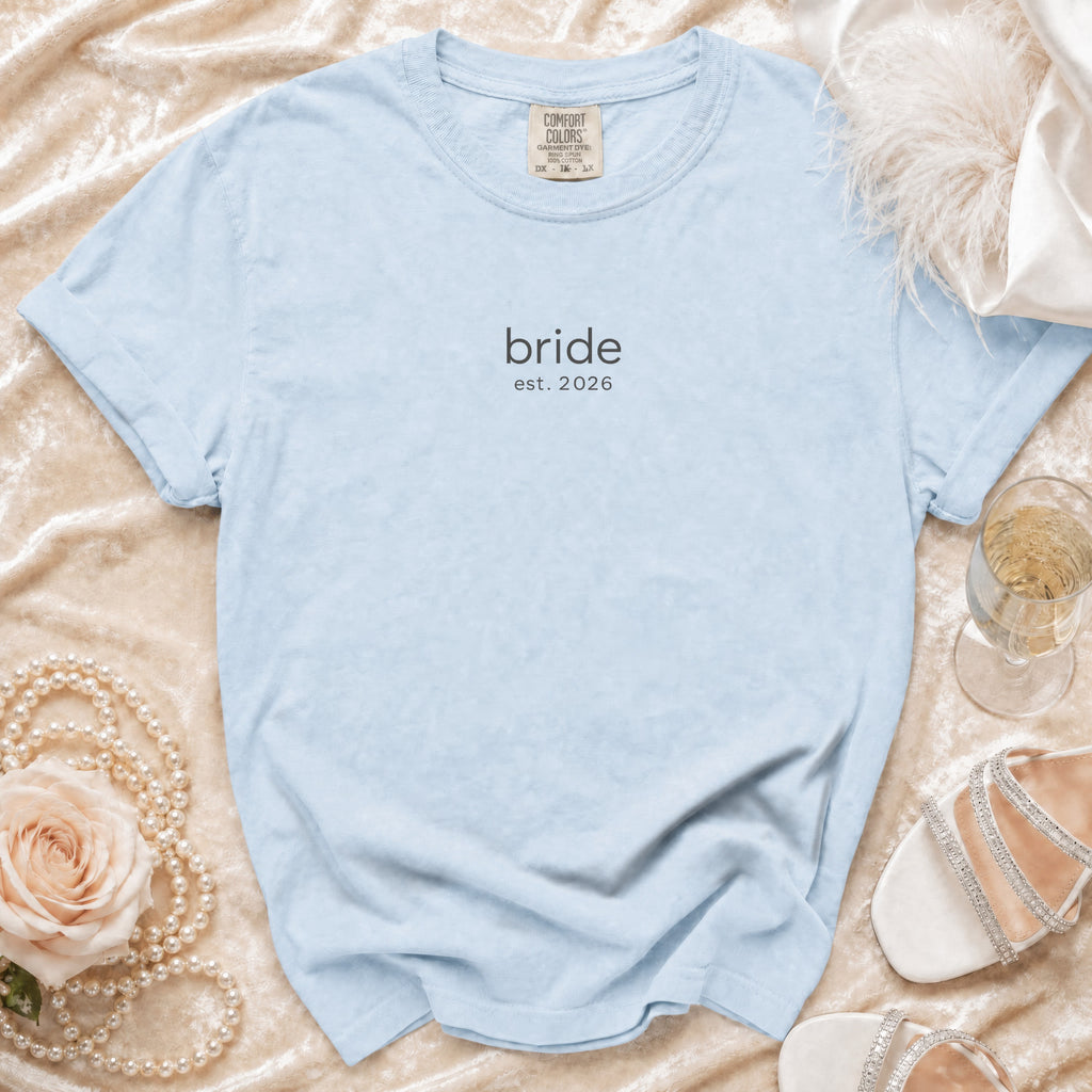 Light blue t-shirt with "bride est. 2026" printed on it.